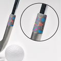 A silver golf club head with a colorful patterned ferrule, shown alongside a white golf ball, tees, and a circular inset close-up of the grip detail on a clean white background.
