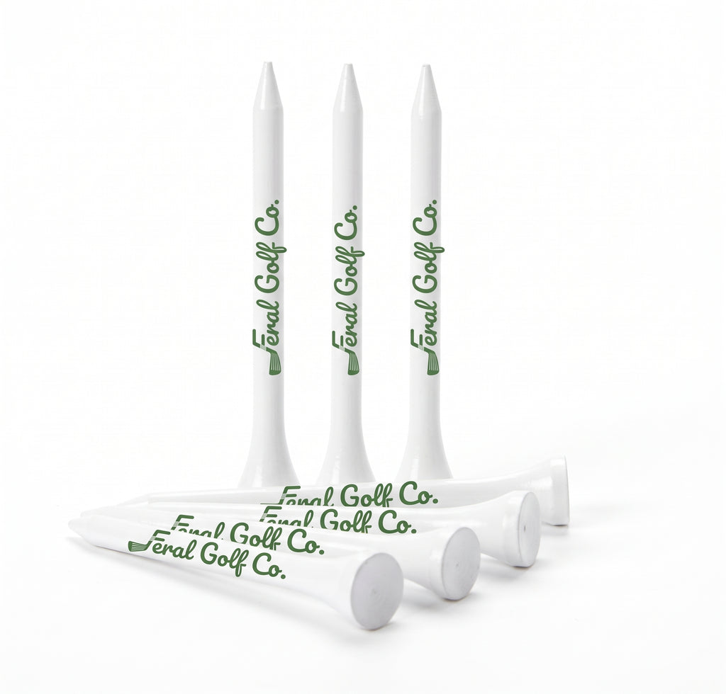 Feral Golf Co. white wooden golf tees with green logo